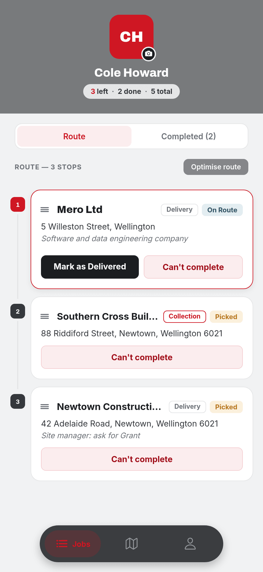 The J.A. Russell driver app's jobs screen, showing a driver's route with three stops, status badges and a 'Mark as Delivered' action
